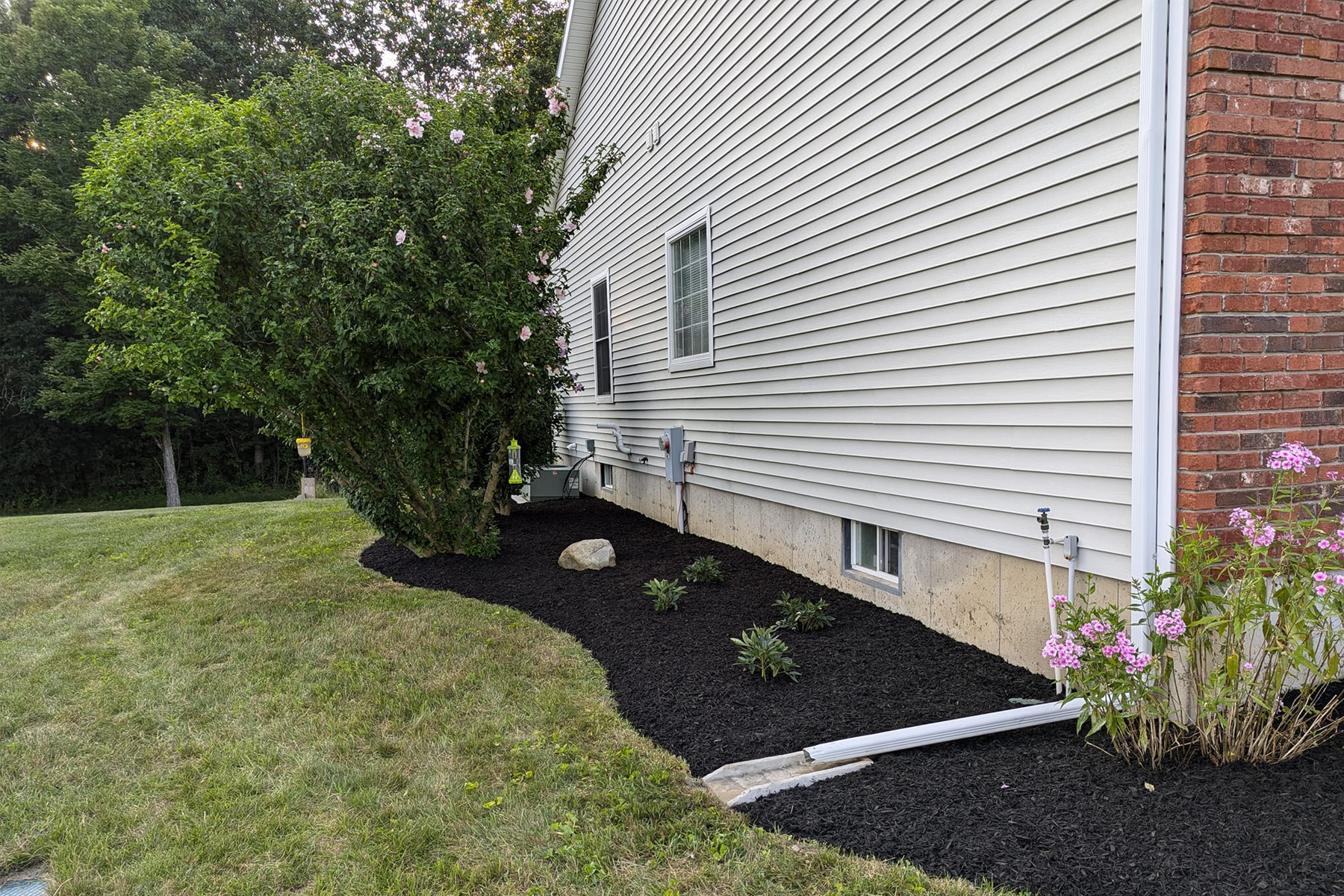 Thumbnail of Installation progress photo of completed retaining wall around pool