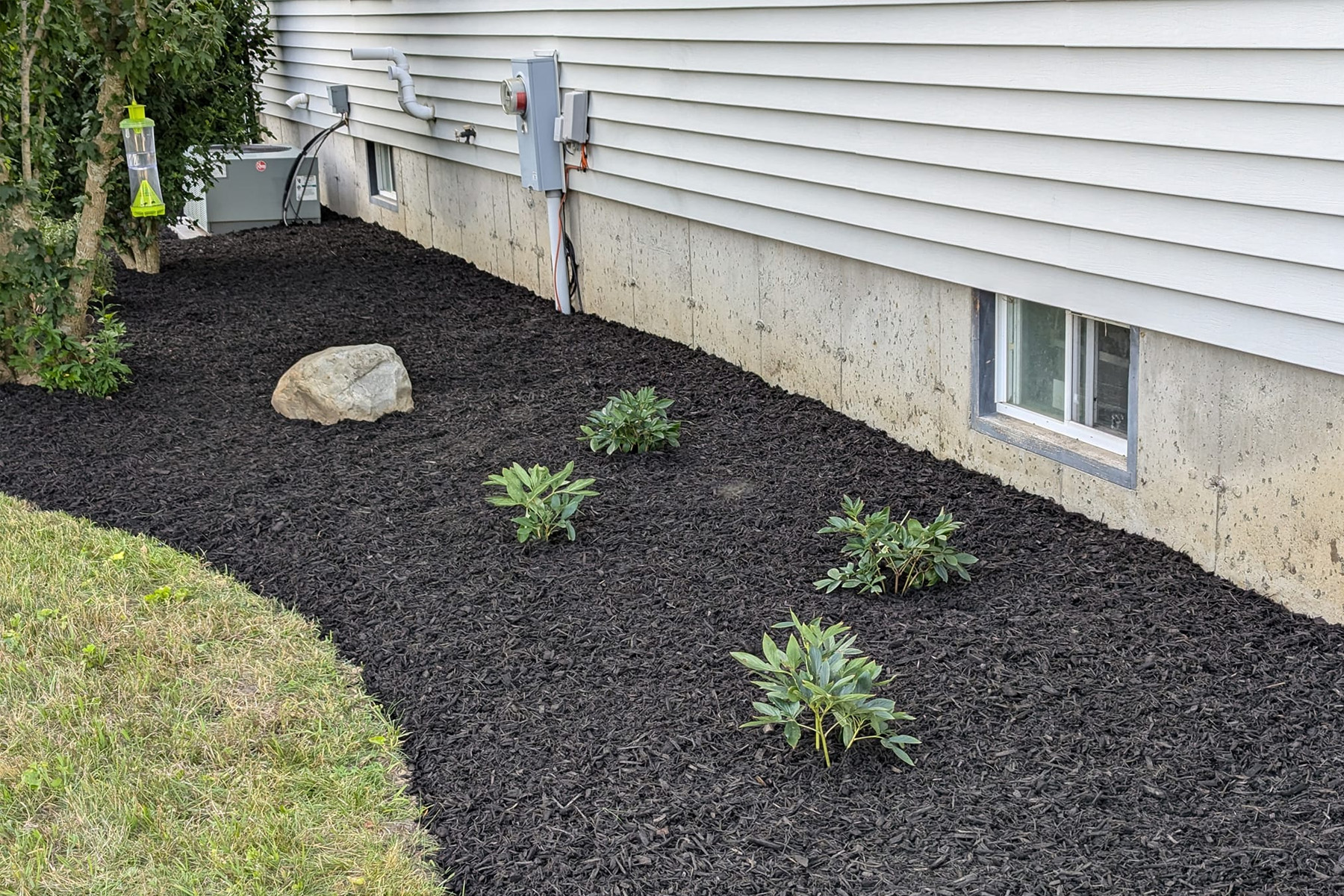 Thumbnail of Installation progress photo of completed retaining wall around pool