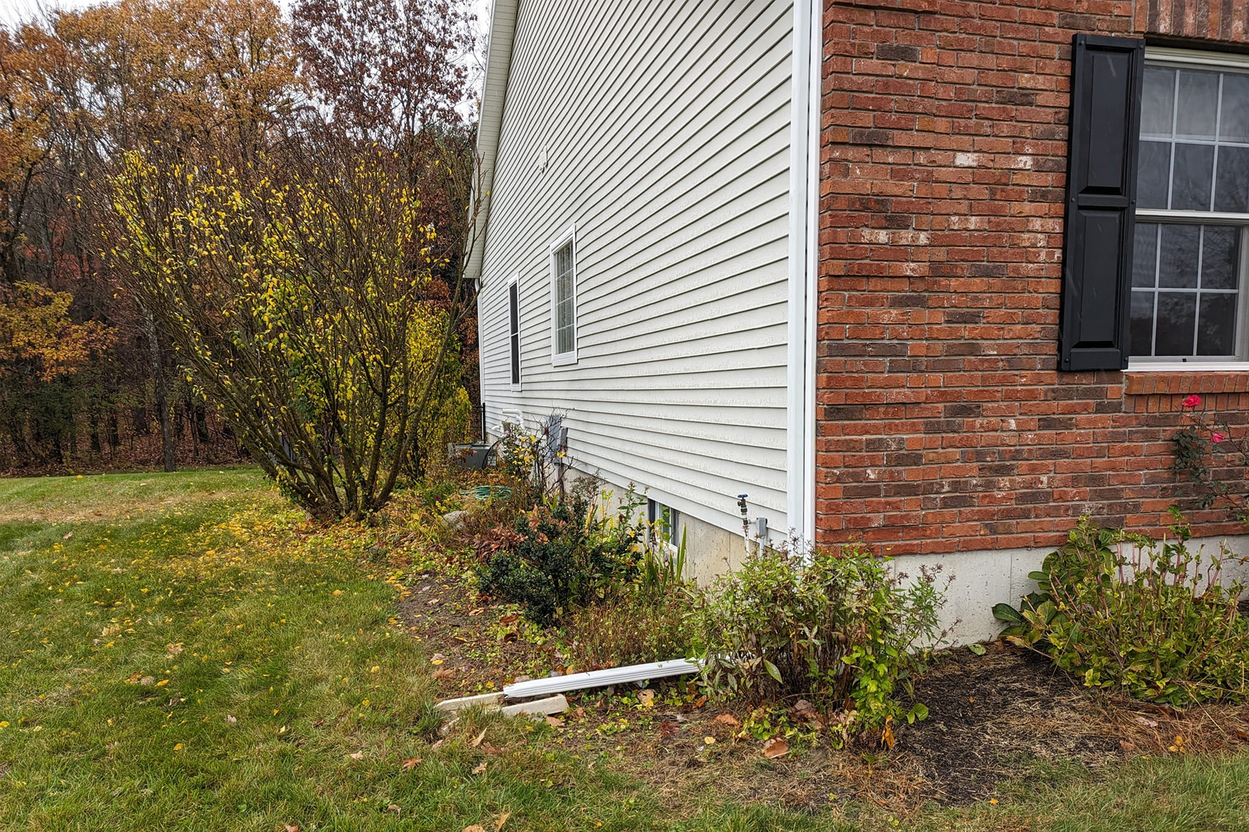 Thumbnail of Installation progress photo of completed retaining wall around pool