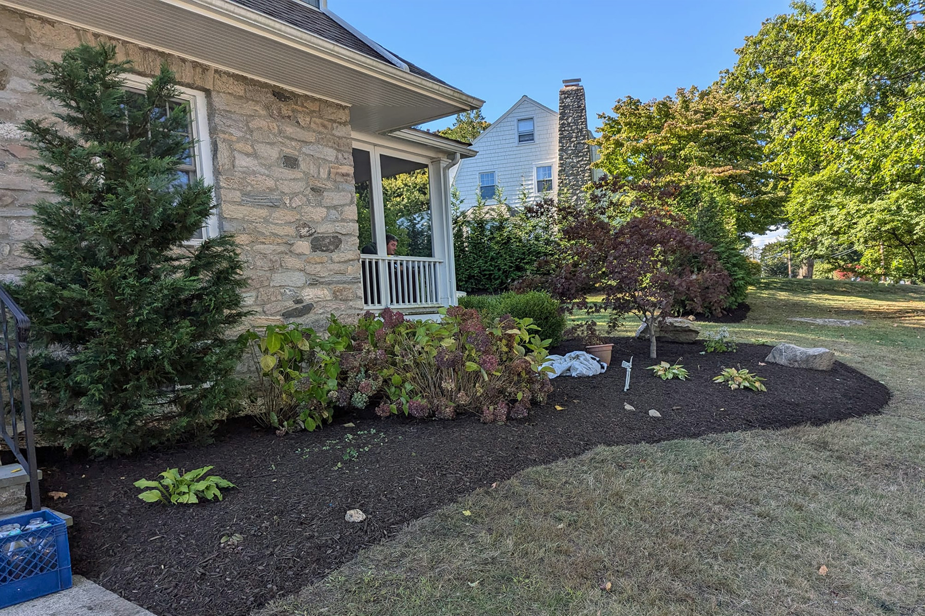 Thumbnail of completed plant bed, along the walkway, with mulch, and stone