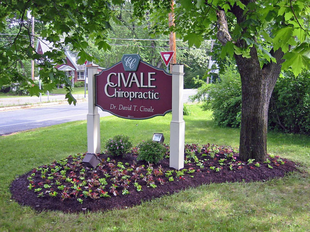 Thumbnail of the newly completed plantbed with fresh mulch under the Civale Chiropractic sign