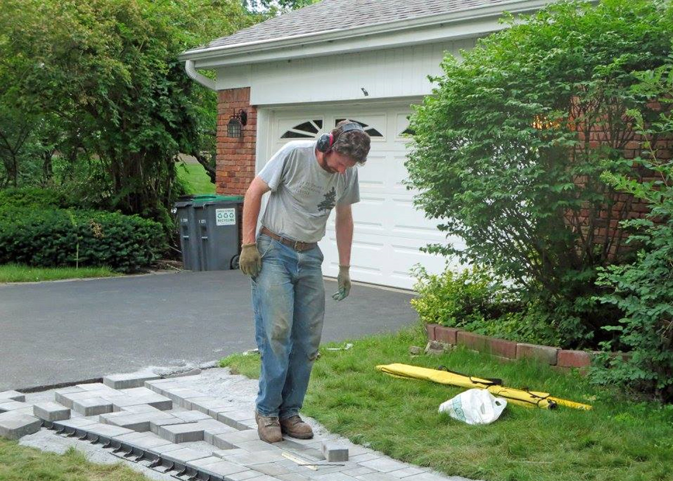 Thumbnail of installation of stone sidewalk in front of house