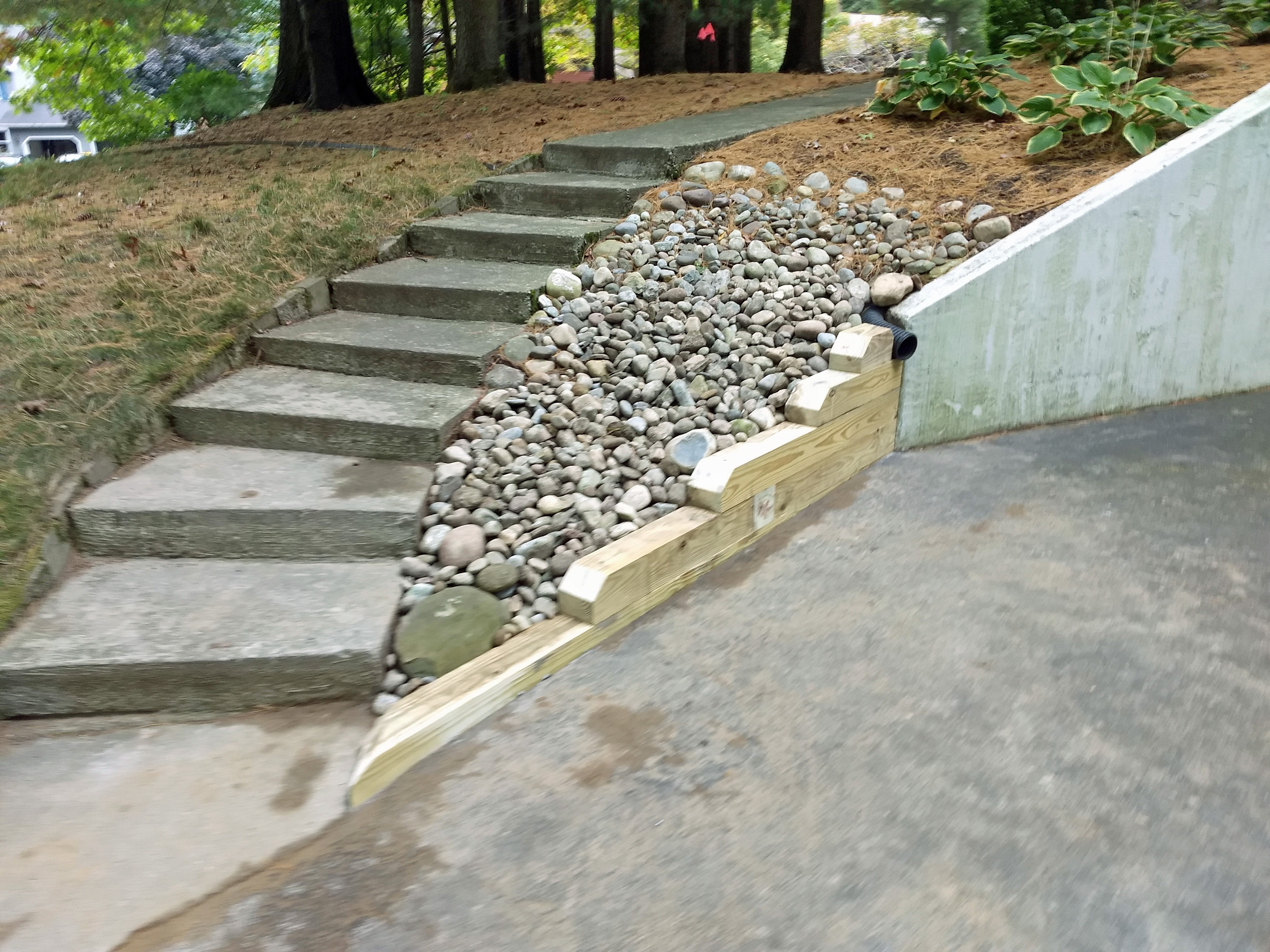 Thumbnail of the newly completed wooden retaining wall and stone bed