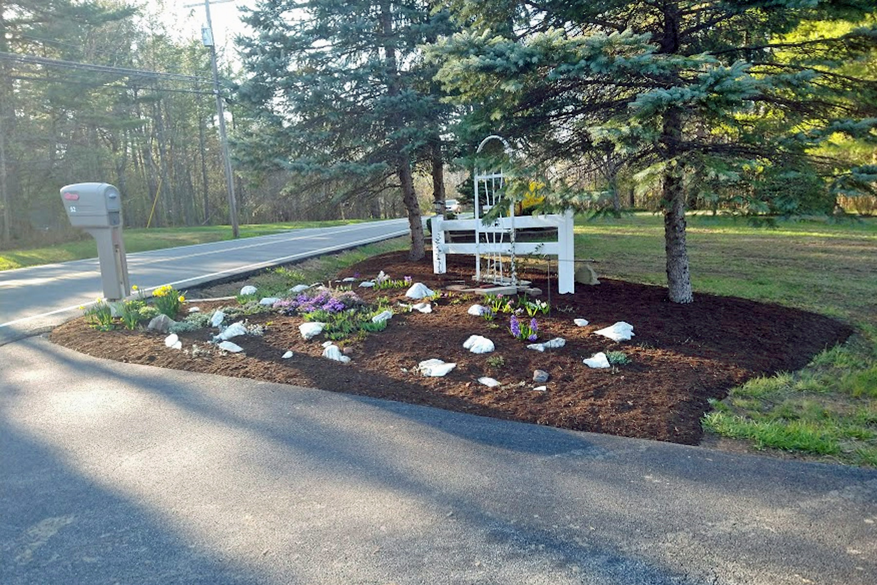 Thumbnail of completed trimming, bed cleanup, and fresh mulch