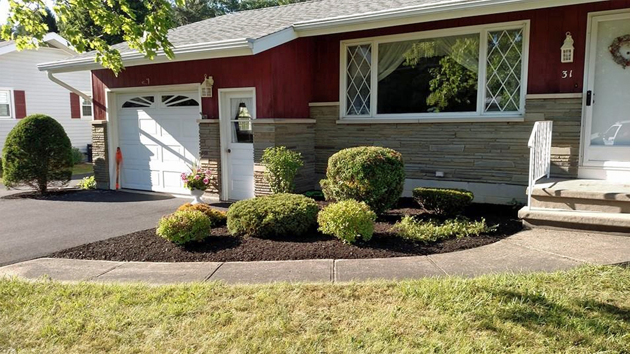 Thumbnail of completed trimming, bed cleanup, and fresh mulch