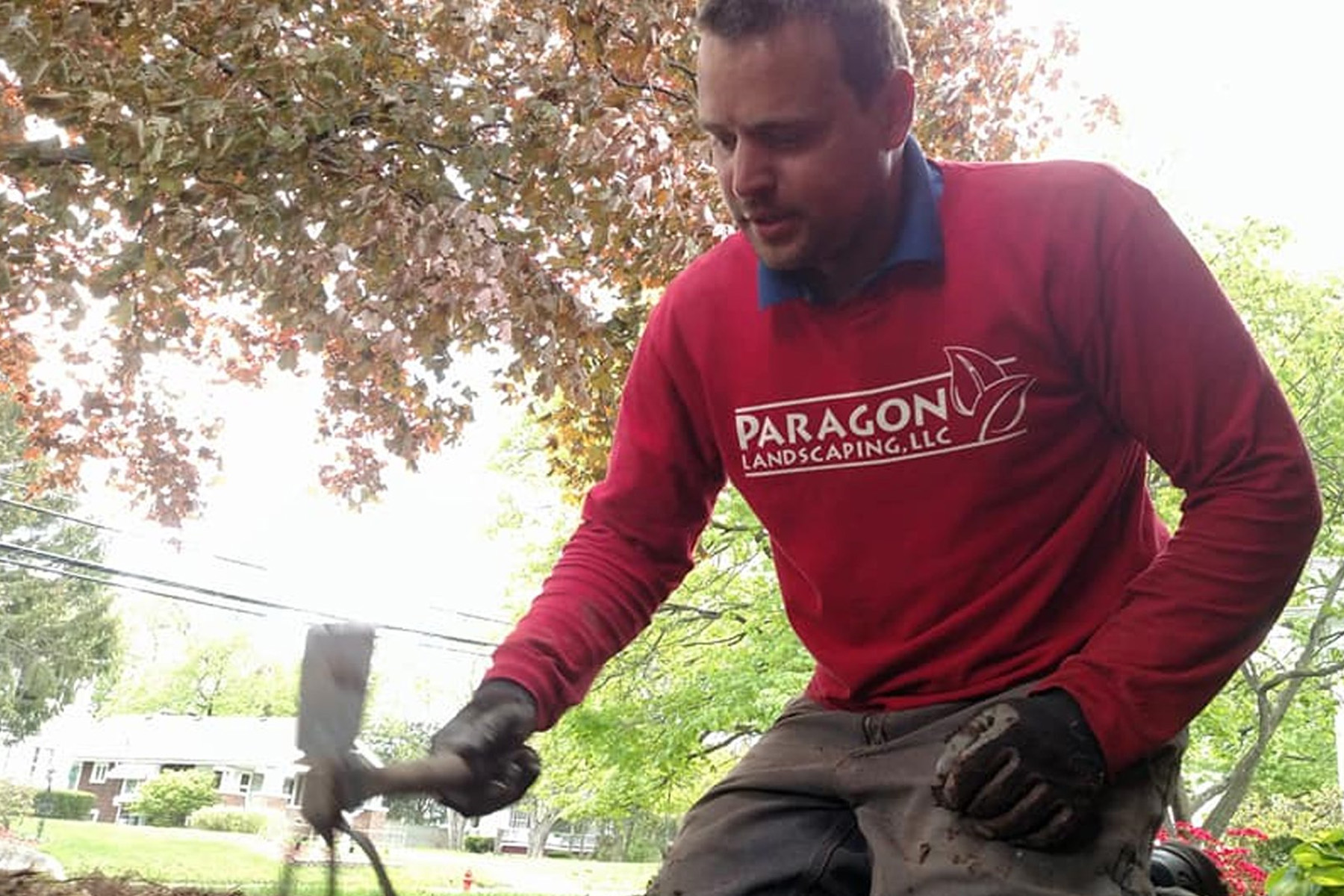 Thumbnail of Joe weeding a plantbed